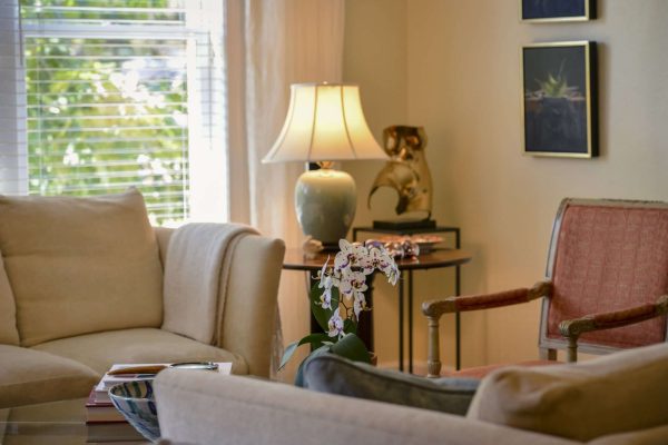 A beige couch in a living room.